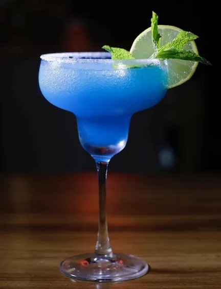 Blended blue cocktail in a martini glass