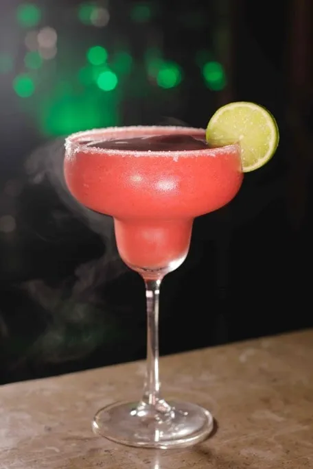 Blended red cocktail in a martini glass